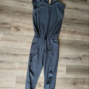 Gray Albion Fit jumpsuit with short sleeves and ankle zippers.